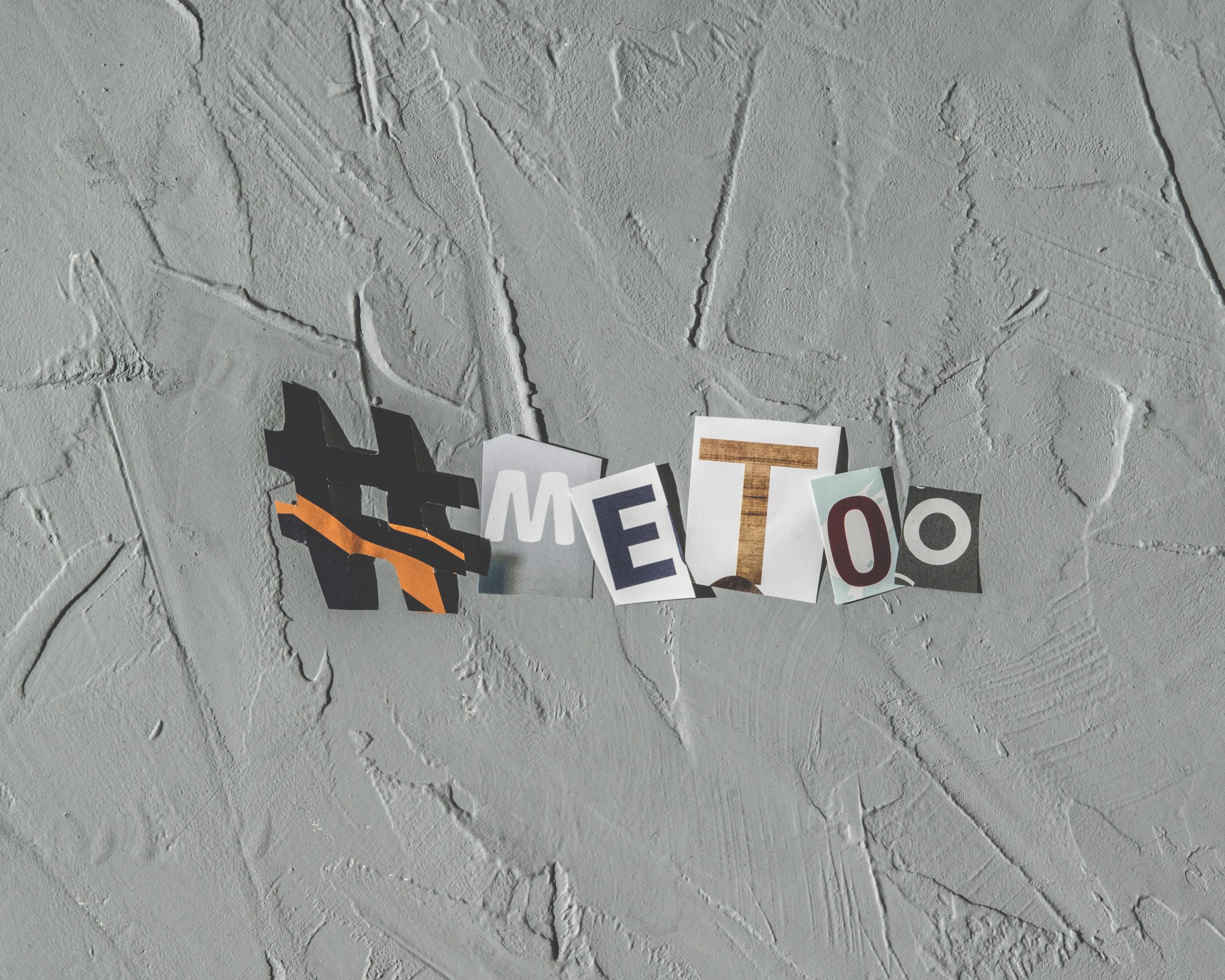 woman holding paper with metoo sign written